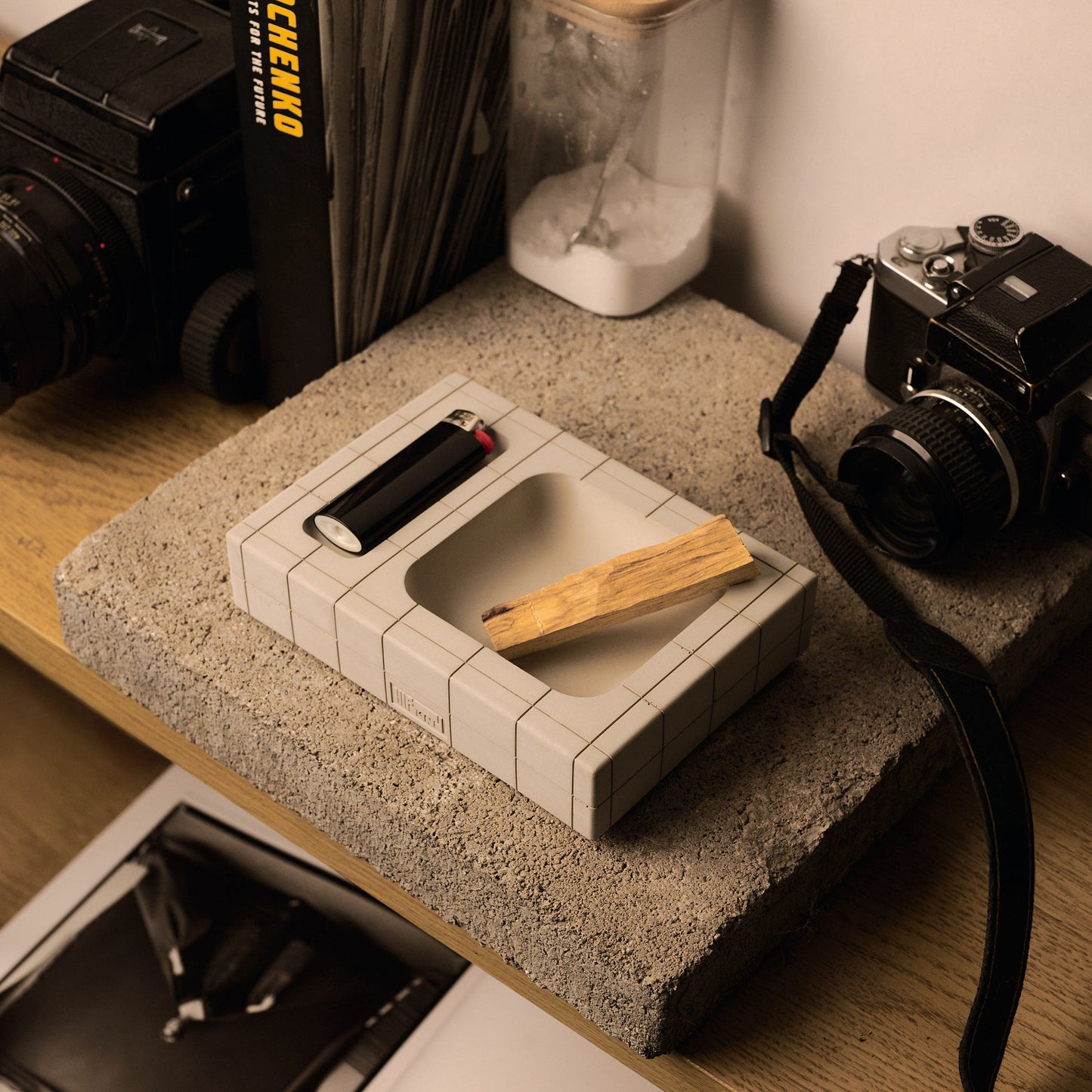 Bone Illfound Pool Tray On Concrete desk surrounded by cameras