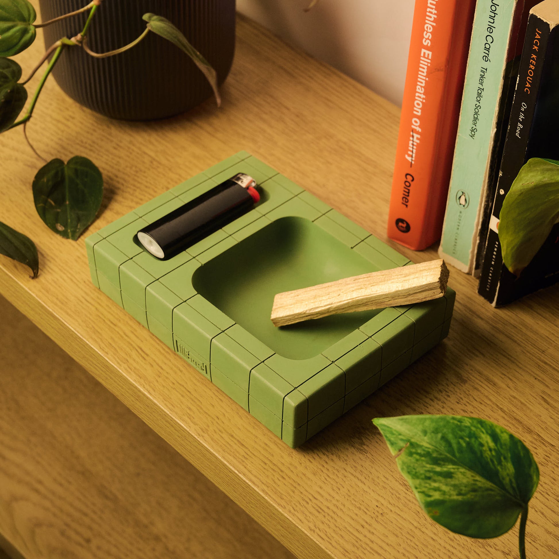 Green Pool Tray by Illfound surrounded by books and plants